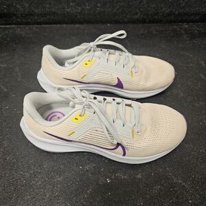 Nike Women's Light Beige Running Shoes with Purple Swoosh and Yellow Accents